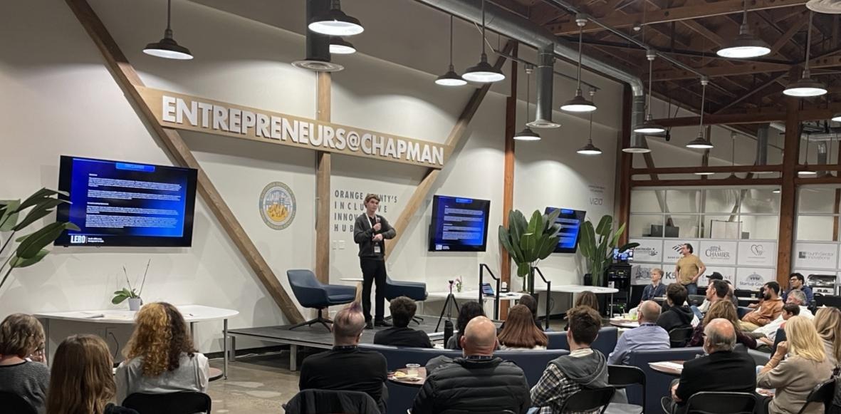 London Leffler presenting during his 2026 founder chapter at age 20.